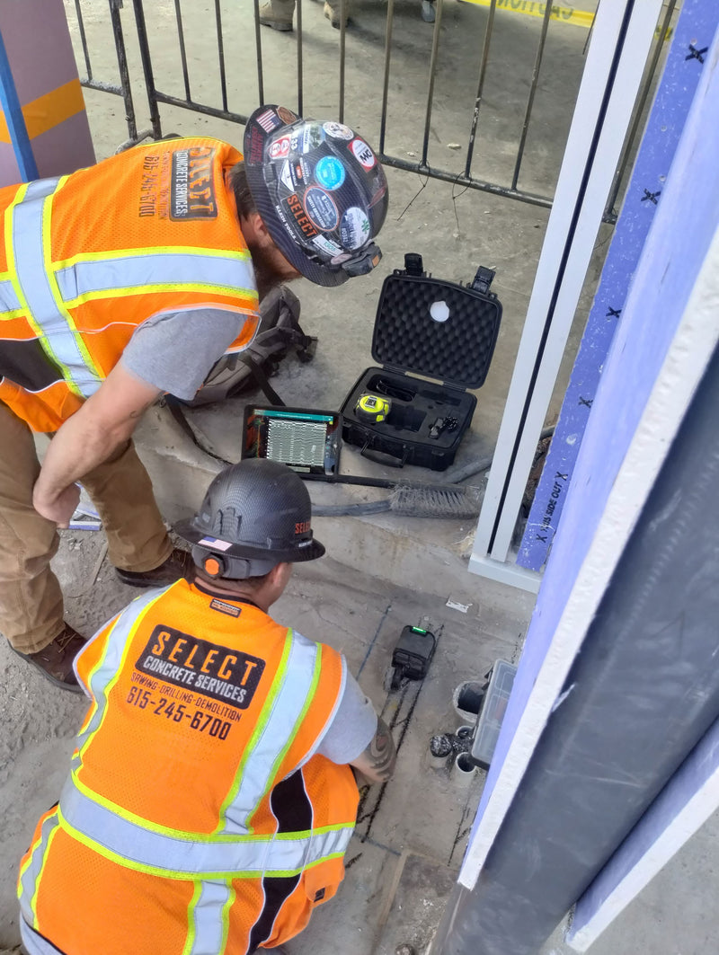 Two Select Concrete Services workers working together on a project